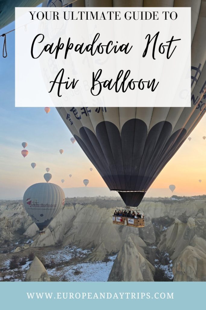A close-up view of a large hot air balloon with passengers drifting above Cappadocia’s snow-dusted valleys at sunrise, with the text “Your ultimate guide to Cappadocia hot air balloon” and the URL europeandaytrips.com
overlayed.