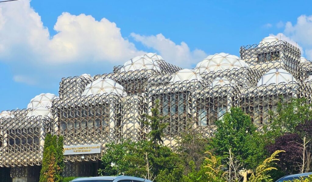 National Library of Kosovo in Pristina, with white domes and a metal lattice covering its exterior.